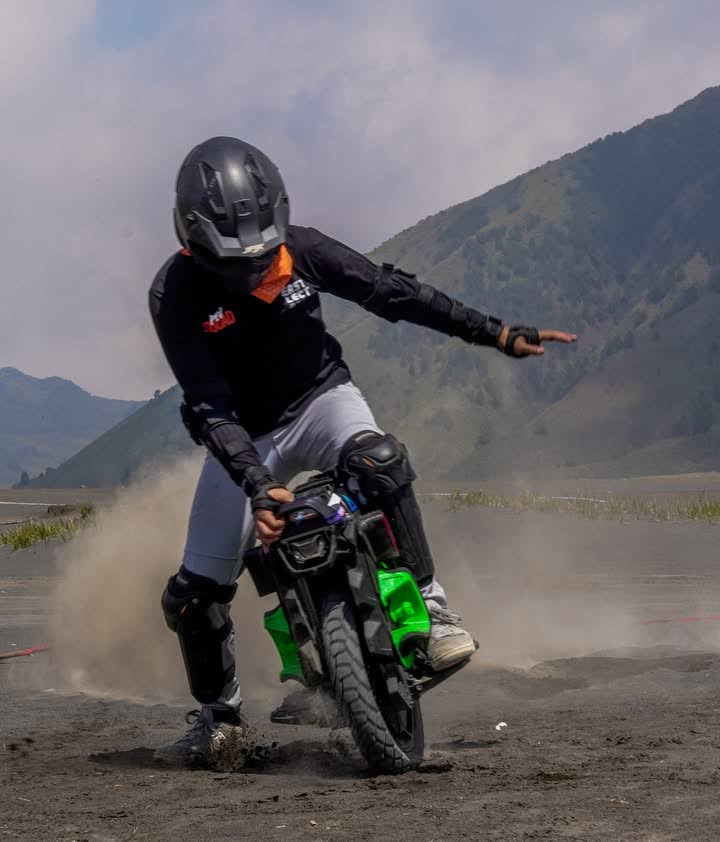 Rider kicking up a plume of volcanic dust