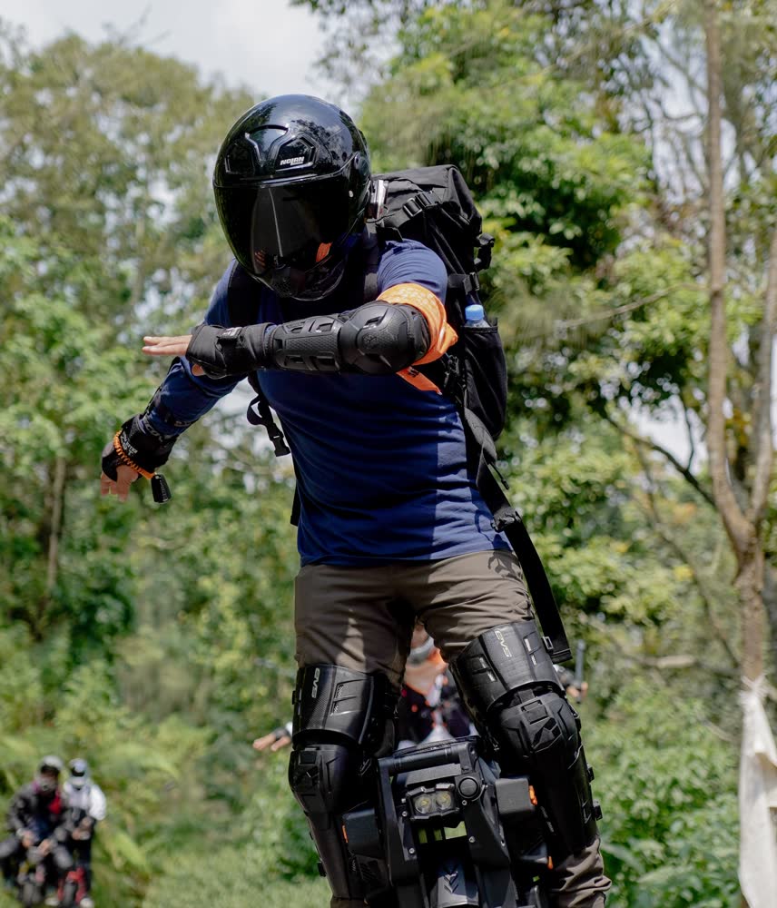 Rider in full kit against the tree line