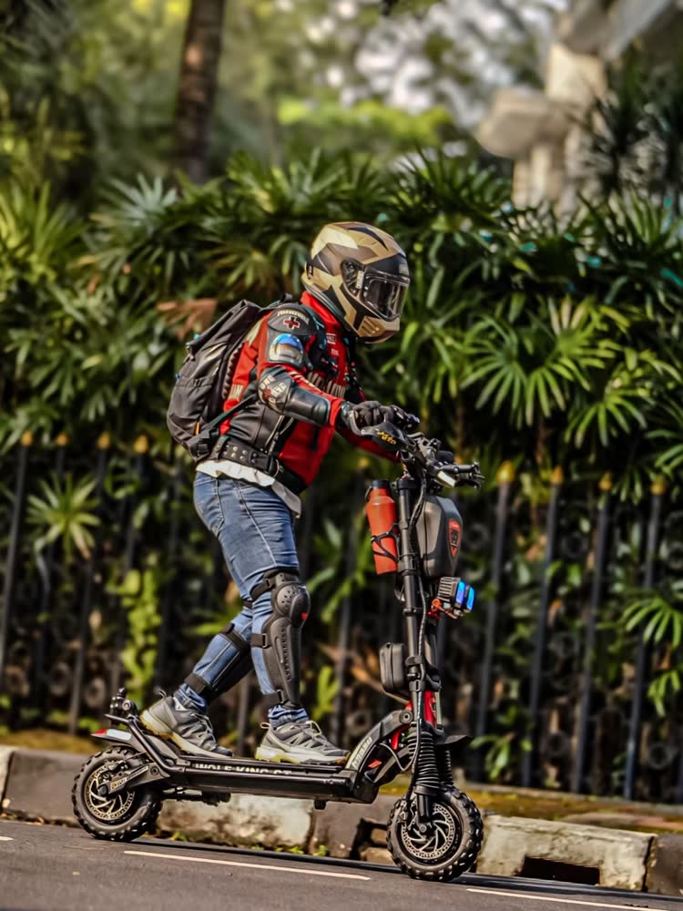 Scooter rider with a backpack riding through the city