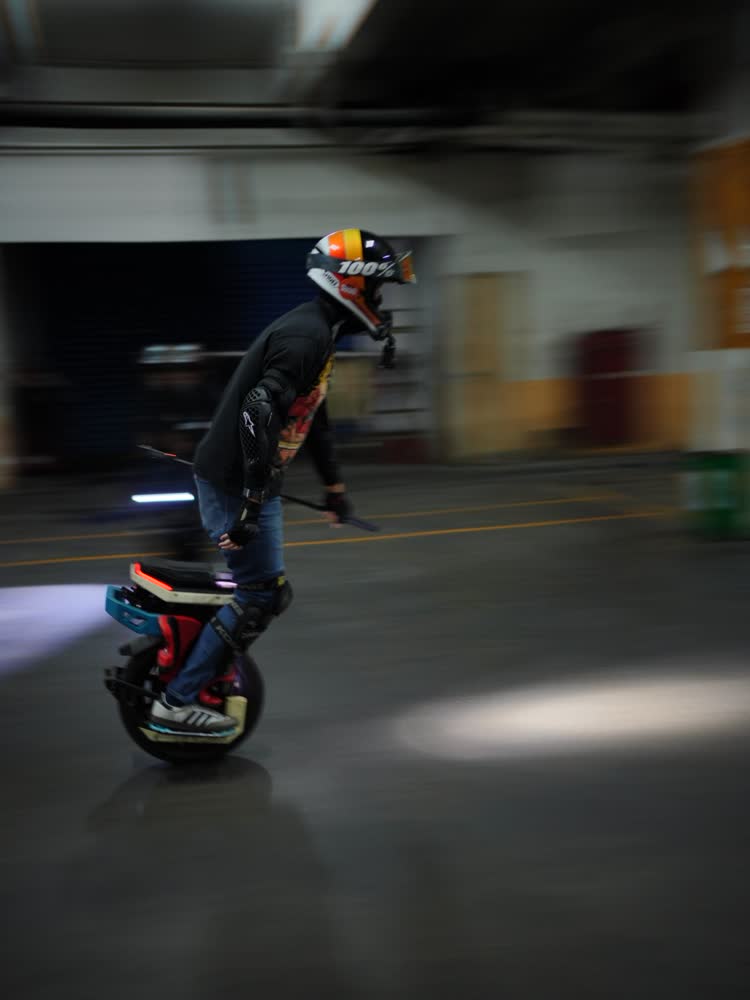 Rider leaning hard into a turn on an EUC