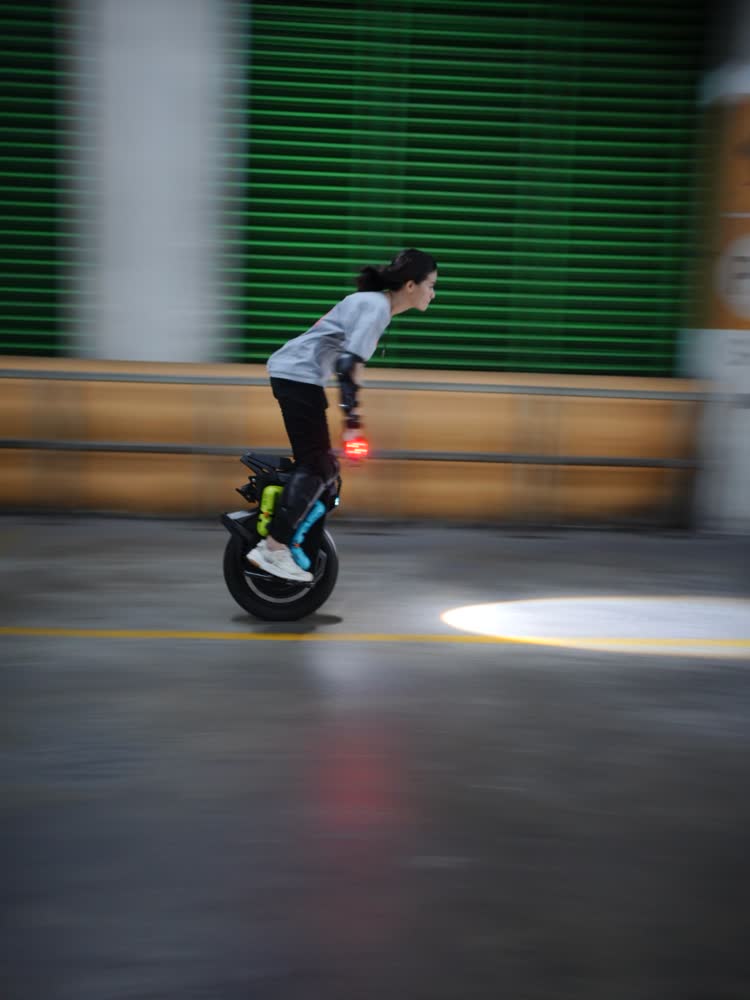 Rider rolling out across the garage floor