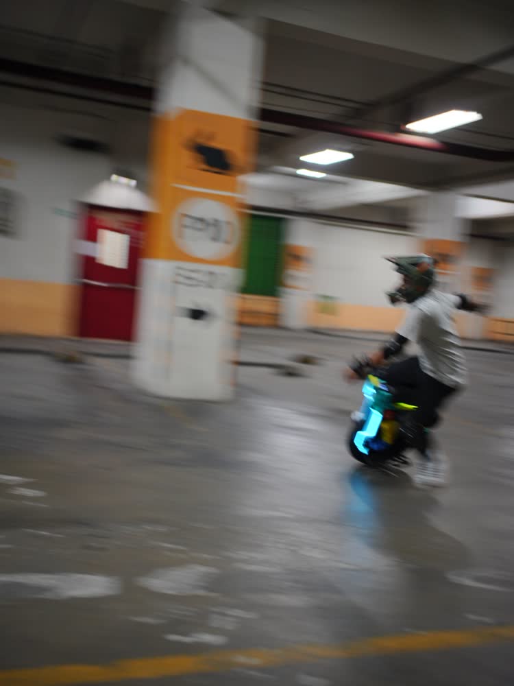 Rider weaving between garage pillars