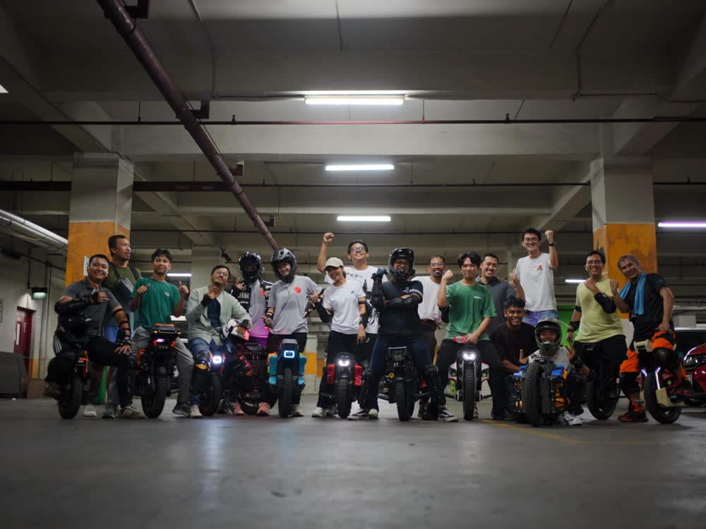 Wide group shot of the squad and their machines
